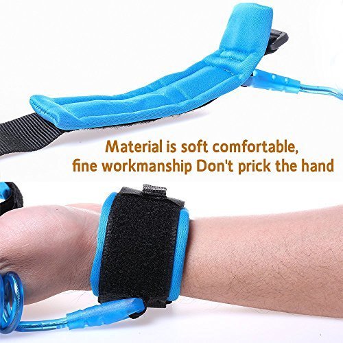 Close-up of a vibrant blue child safety wrist link, showing soft, adjustable cuffs on two wrists and a strong, flexible coiled tether, ideal for preventing children from wandering off, from Usmile Toys. www.usmile.toys